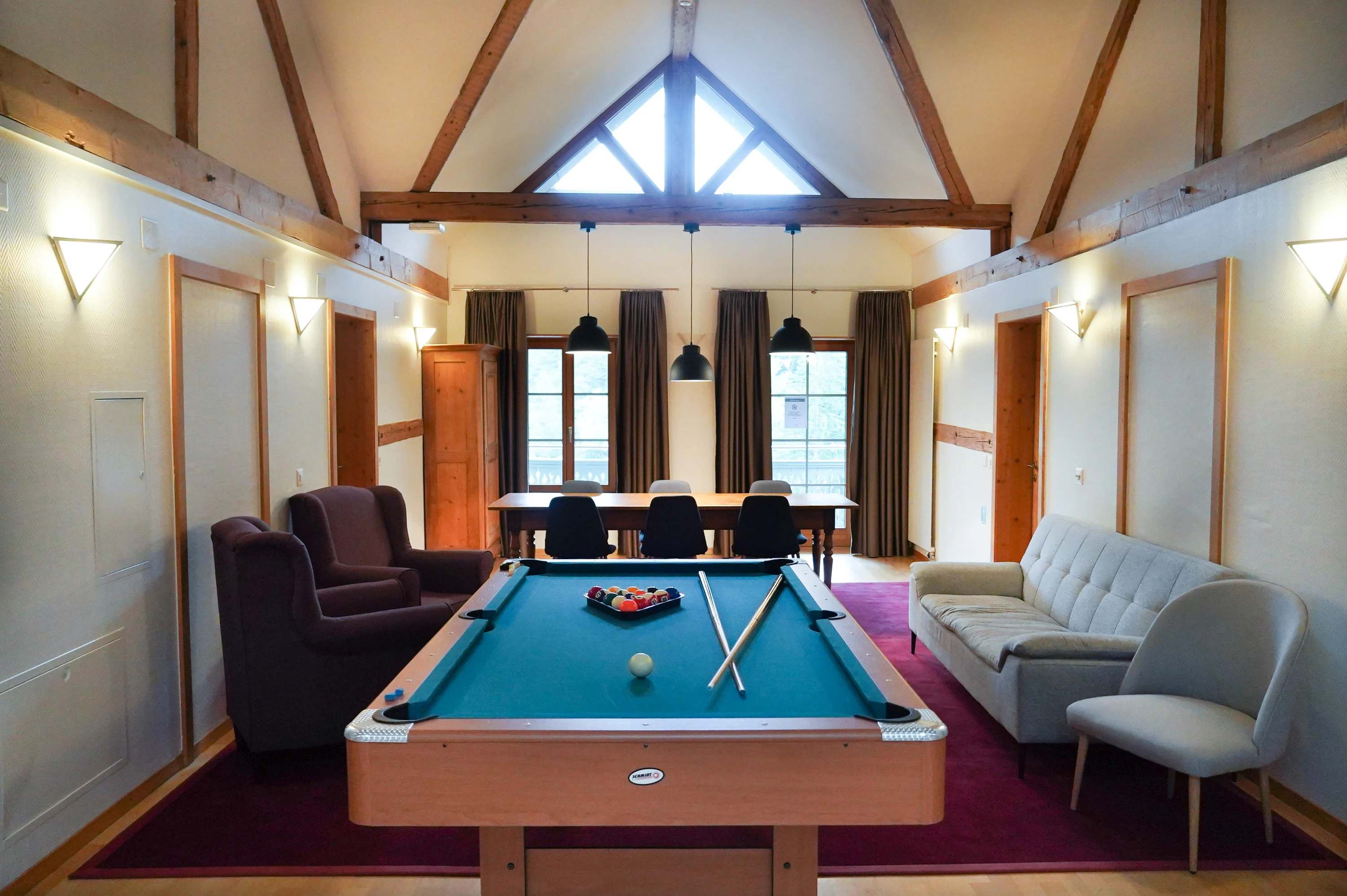 Hotel Fontana lounge with professional pool table and exposed wooden beams